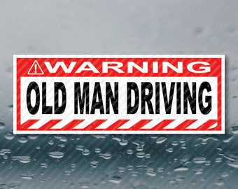 May include: Red and white warning sign with black text that reads "WARNING OLD MAN DRIVING".