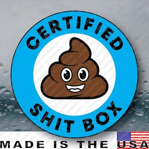 May include: A circular sticker with a bright blue border and a white center. The text CERTIFIED SHIT BOX is printed in black capital letters around the border. In the center is a brown cartoon poop emoji with large white eyes and a smiling mouth.