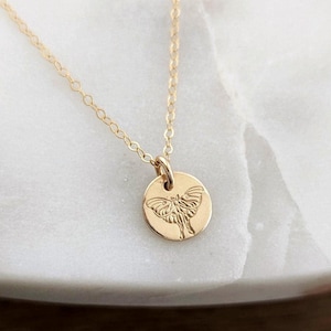 May include: A set of three ceramic mugs with a speckled, matte finish. The mugs are in shades of cream, light brown, and dark brown. Each mug has a simple, minimalist design and a rounded handle.