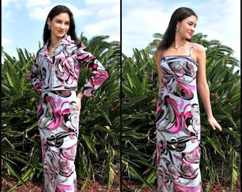 May include: Two women wearing different patterned dresses with pink and black accents. The dresses are long and flowy, and the women are wearing black heels.