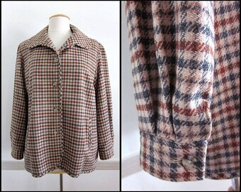 May include: A brown, black, and beige plaid jacket with a button-up front and long sleeves.