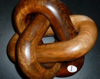 Borromean rings, hand carved wood  knot sculpture of hopf / brunnian links, abstract carving of trinity.
