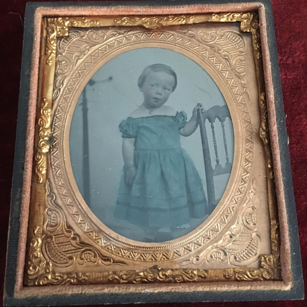 1860's Tinted AMBROTYPE Of Little BOY Wearing Off the Shoulder Dress with Visible Head CLAMP in Background