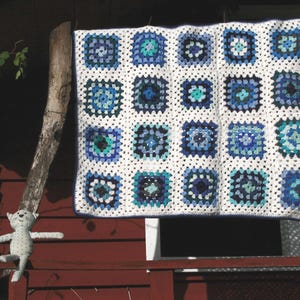 New handmade crocheted baby blanket, ROMEO,granny squares in white and blue.
