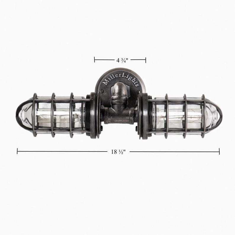 Technical dimension diagram of 'The Joker' double cage vanity light by MillerLights®, showing a total fixture width of 18.5 inches and a 4.75 inch round mounting base plate, against a clean white background.