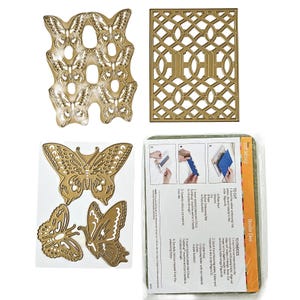 May include: A collection of gold-colored metal die cuts, including butterfly and geometric designs. The image also shows a package with instructions for cutting and embossing with a Cuttlebug machine. Ideal for paper crafting and scrapbooking projects.
