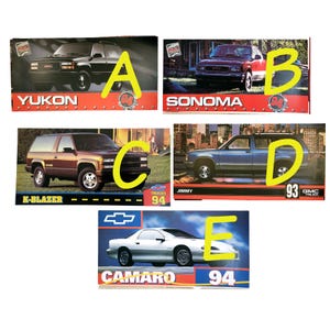 May include: A collection of vintage car trading cards featuring various models. The cards showcase a black GMC Yukon, a red GMC Sonoma, a brown K-Blazer, a blue GMC Jimmy, and a white Camaro. Each card has the model name and year.
