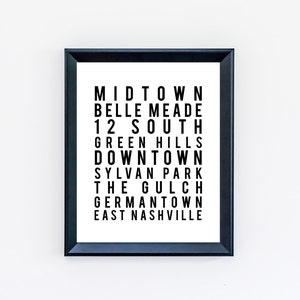 May include: Black and white framed print with the names of different neighborhoods in Nashville, Tennessee. The text reads: Midtown, Belle Meade, 12 South, Green Hills, Downtown, Sylvan Park, The Gulch, Germantown, East Nashville.