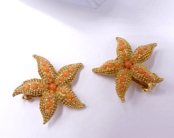 Vintage gold tone & faux coral starfish clip earrings