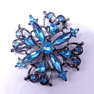Vintage dark metal tone & blue rhinestone pin brooch
