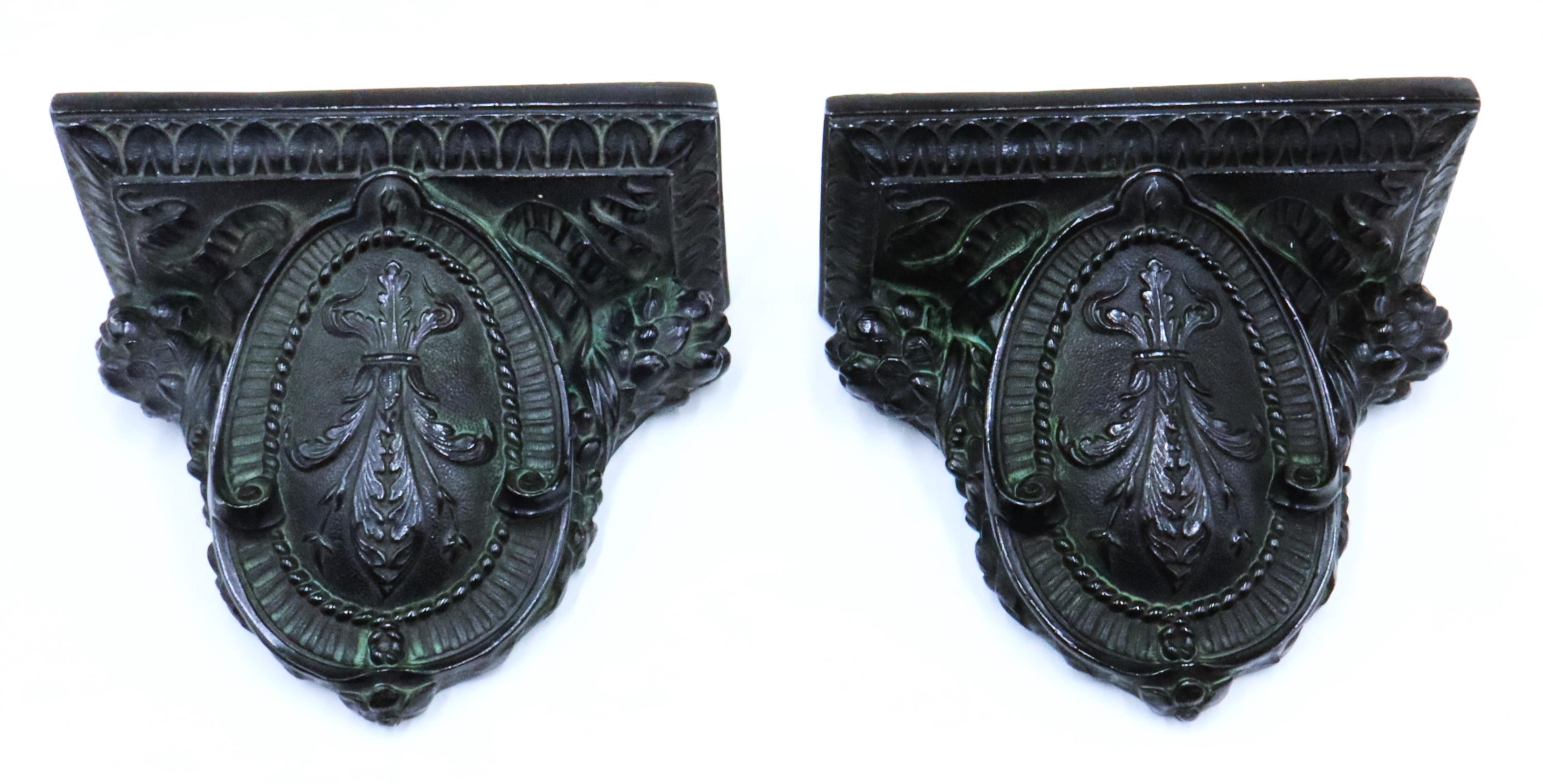 Antique pair of Victorian carved hollow metal wall bracket shelf color coal