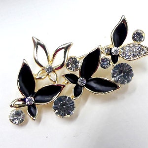 Vintage gold tone black enamel & clear rhinestone pin brooch