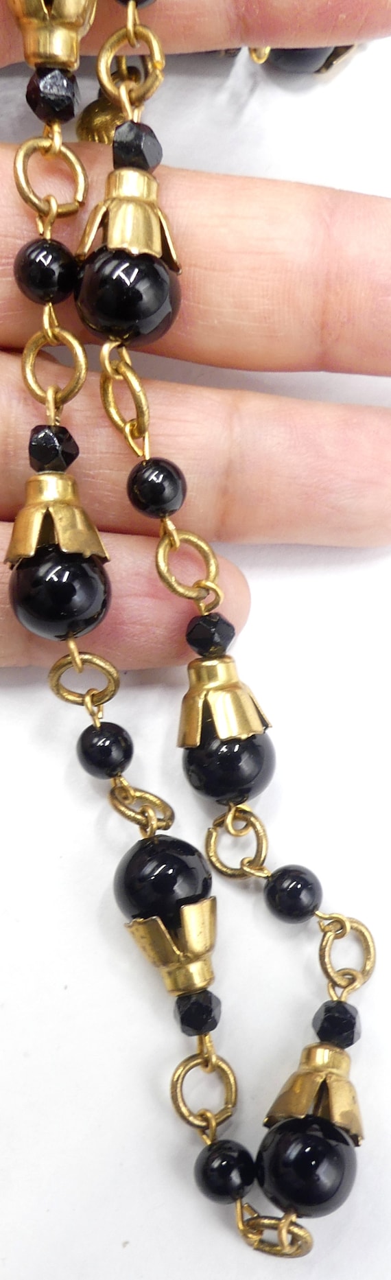 Antique gold tone cap & black glass beads necklace