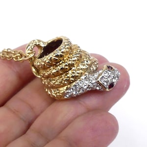 Vintage unsigned Kenneth Jay Lane gold tone rhinestone snake pendant necklace