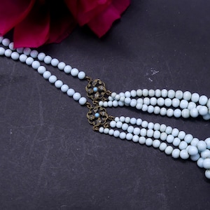 Vintage 40&#39;s brass clasp & light blue glass beads necklace