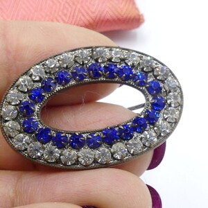 Antique oval shape brass tone blue clear rhinestone brooch