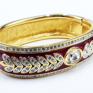 Vintage Swarovski swan mark gold tone red enamel & clear rhinestone bangle