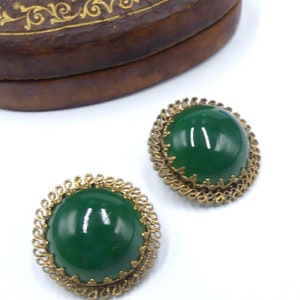 Vintage large 40&#39;s marked made in Austria brass tone filigree & green glass cabochon clip earrings