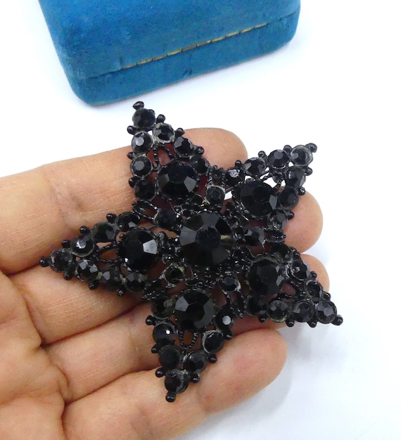 Vintage 60's black metal and black star pin brooch