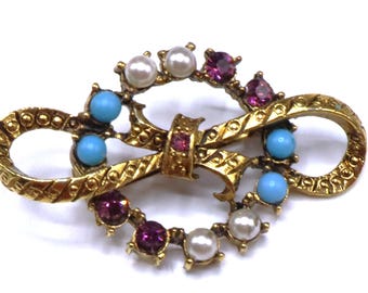 Broche vintage de turquesa con perla sintética y diamantes de imitación morados y dorados de los años 60