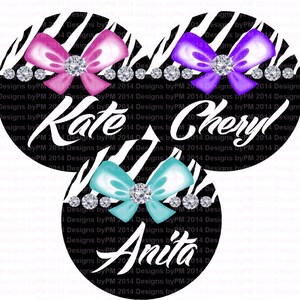 May include: Three black and white zebra print circles with a bow and rhinestones in the center. The names "Kate", "Cheryl", and "Anita" are written in white on each circle.