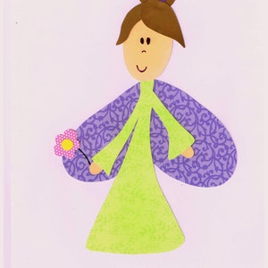 May include: A paper craft of a girl with brown hair, wearing a purple and green dress and holding a pink flower.