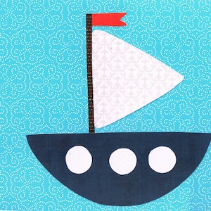 May include: A blue sailboat with a white sail and a red flag. The sailboat has three white circles on the bottom.