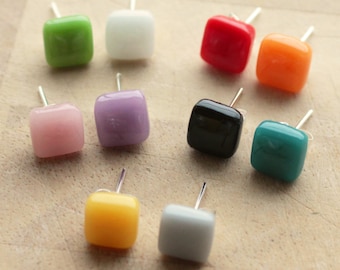 May include: Assortment of ten pairs of square glass earrings in various colours, including green, white, red, orange, pink, purple, black, teal, yellow, and grey.