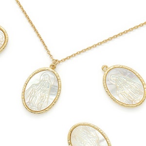 May include: A gold chain necklace with multiple oval-shaped pendants. Each pendant features a white mother-of-pearl inlay with a religious image.