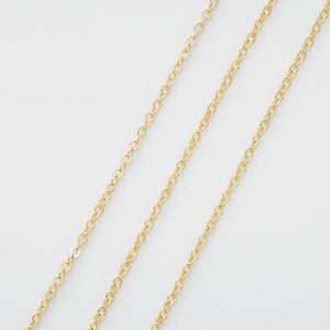 May include: Three gold chains of different lengths and thicknesses.