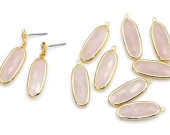 May include: A set of nine oval-shaped rose quartz pendants with gold-toned metal settings. The pendants have a smooth, polished finish and are perfect for jewelry making.