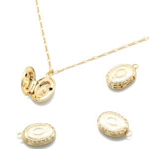 May include: A gold chain necklace with a gold locket pendant. The locket is open and has a detailed design. There are several other gold lockets scattered around the necklace.