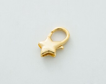 May include: Gold-toned metal star-shaped clasp with a spring-loaded opening.