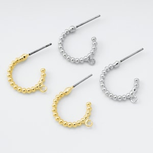 May include: Three pairs of hoop earrings with a beaded design. Two pairs are gold and one pair is silver.