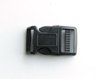 May include: Black plastic buckle with a side release clasp. The buckle has a smooth, matte finish.