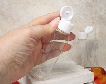 2 oz plastic bottle, set of 3 clear squeeze bottles refillable travel bottles with White Flip Top caps for shampoo and lotion accessories