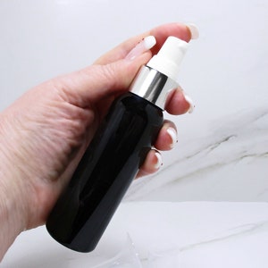 2 oz pump bottles, set of 3 black PET plastic bottles with white and silver treatment pump, face serum or hand cream refillable pump bottles