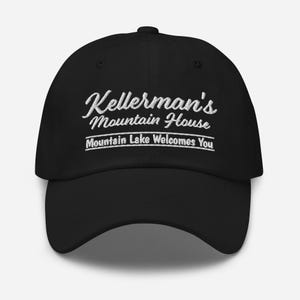 May include: Black baseball cap with white embroidered text that reads "Kellerman's Mountain House" and "Mountain Lake Welcomes You".