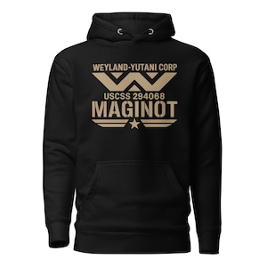 Pode incluir: Moletom preto com uma estampa bege na frente. A estampa inclui o texto "WEYLAND-YUTANI CORP", "USCSS 294068" e "MAGINOT", juntamente com um logotipo estilizado e uma estrela.
