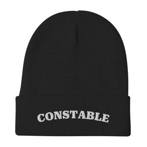 May include: Black beanie with a white embroidered word "CONSTABLE" on the cuff.