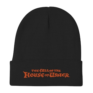 May include: Black knit beanie with a fold-over cuff and an orange embroidered logo that reads "THE FALL OF THE HOUSE OF USHER"