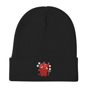 May include: Black knit beanie with a red cartoon devil holding a pitchfork and surrounded by white hearts.