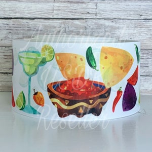 May include: White ribbon featuring a colorful illustration of a margarita, chips and salsa, and various peppers. The design includes a margarita glass, tortilla chips, a bowl of salsa, and lime slices. The ribbon is suitable for crafting and decorative purposes.