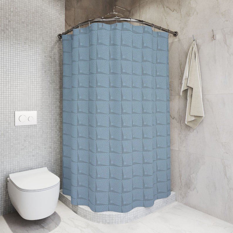 May include: A blue shower curtain with a geometric pattern of squares. The curtain is hung on a curved shower rod.