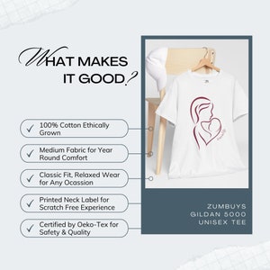 May include: White unisex t-shirt with a maroon graphic of a mother and child. The text "ZUMBUYS GILDAN 5000 UNISEX TEE" is printed below the graphic. The t-shirt is made of 100% ethically grown cotton and is certified by Oeko-Tex for safety and quality.