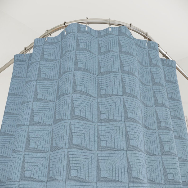 May include: A blue shower curtain with a geometric pattern of squares.
