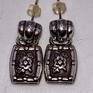 May include: A weathered wooden sign, inscribed with 'Welcome to our home' in white. The sign has a distressed appearance, ideal for a porch or hallway, creating a warm and inviting atmosphere.