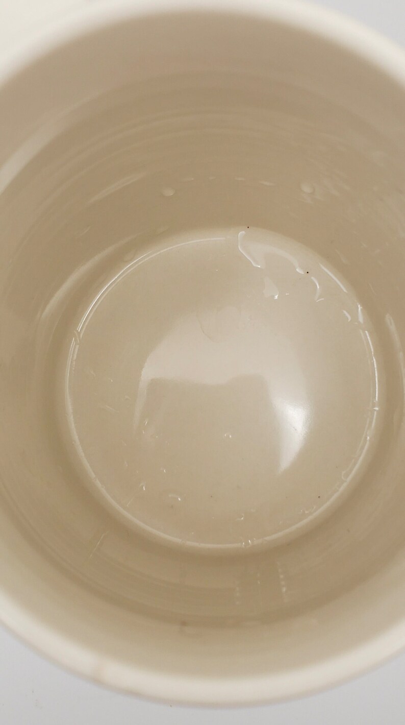 May include: White ceramic mug with a smooth, glossy interior. The mug is empty and appears to be new.