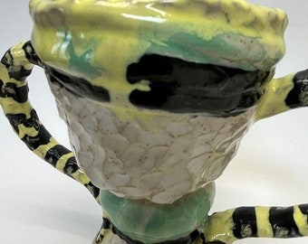 Ceramic stripy yellow and black trophy