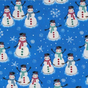Muñecos de nieve sobre tela azul 100 % algodón de Choice Fabrics. Se vende cortada a medida.